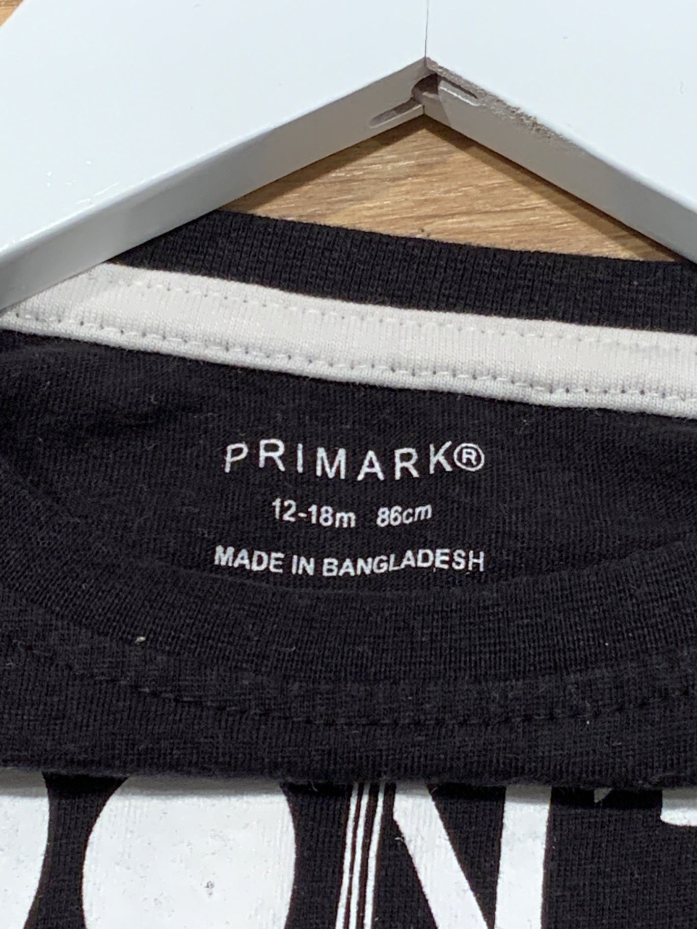 S Primark Tröja 86 Svart med vit text